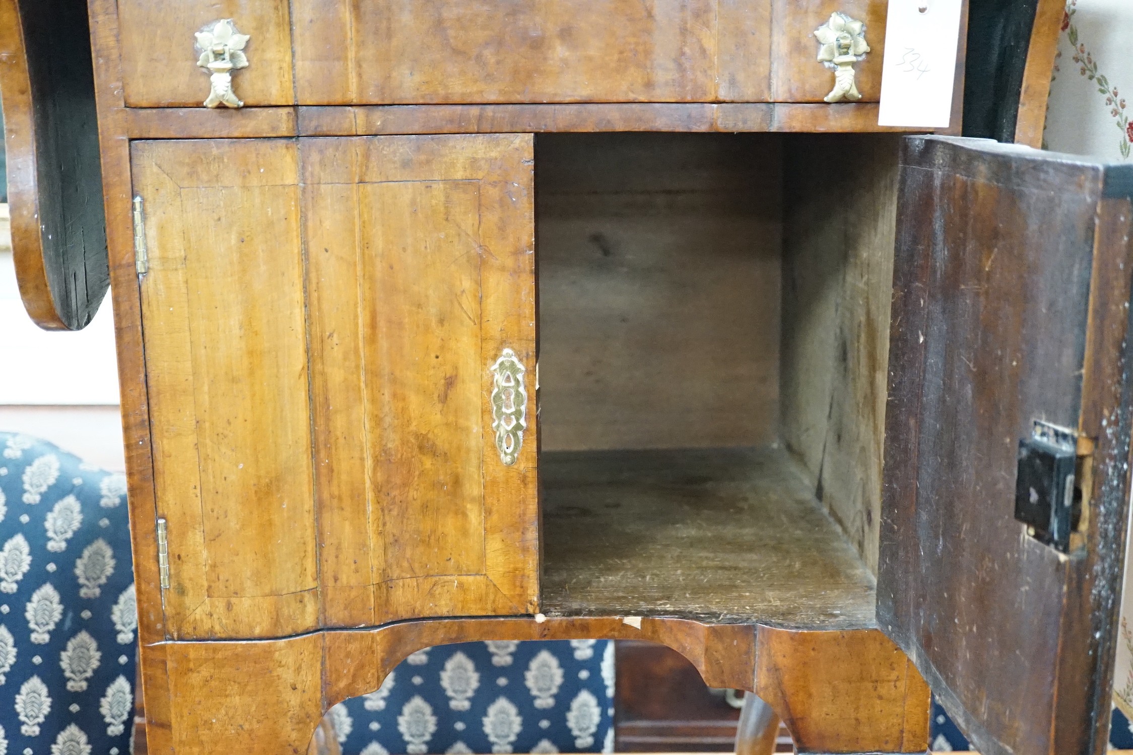 A 1930's walnut bedside cabinet, width 55cm *Please note the sale commences at 9am.